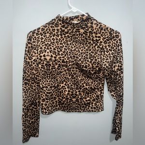 Cheetah print longer sleeve  Size SMALL.
